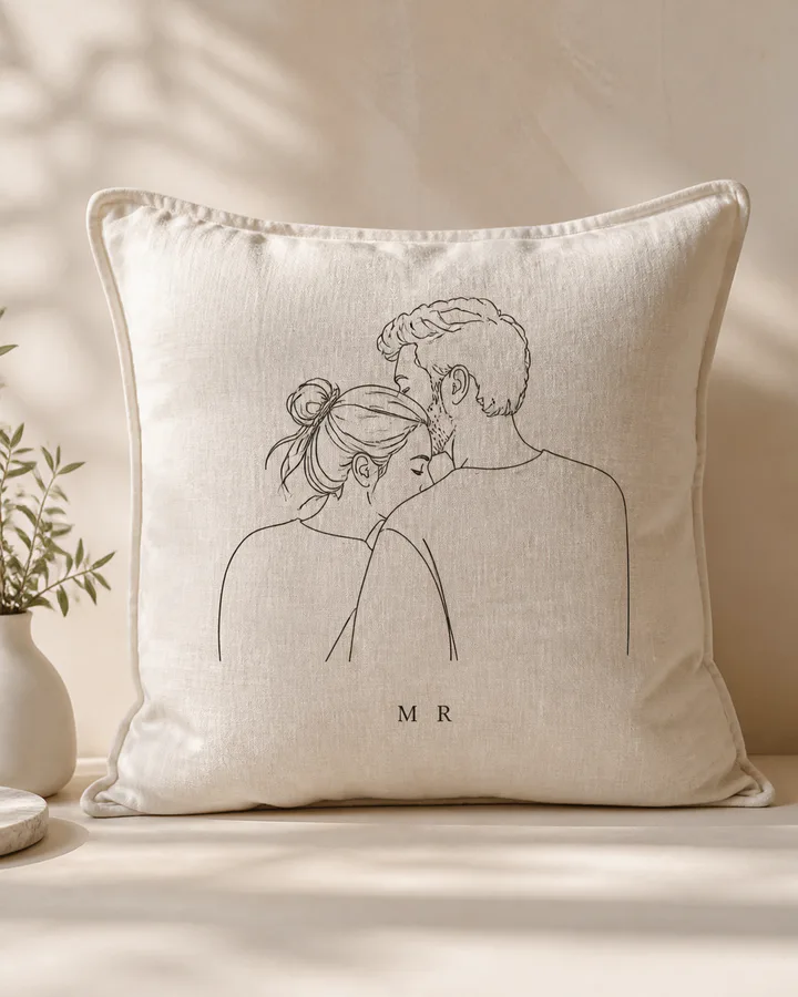 Linen cushion with a personalized couple portrait and initials