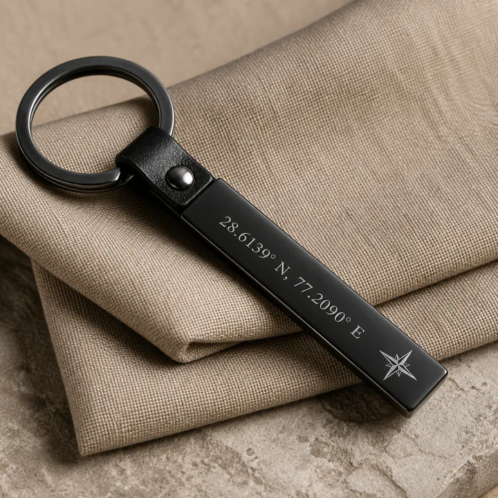 Matte black keychain engraved with personalized coordinates