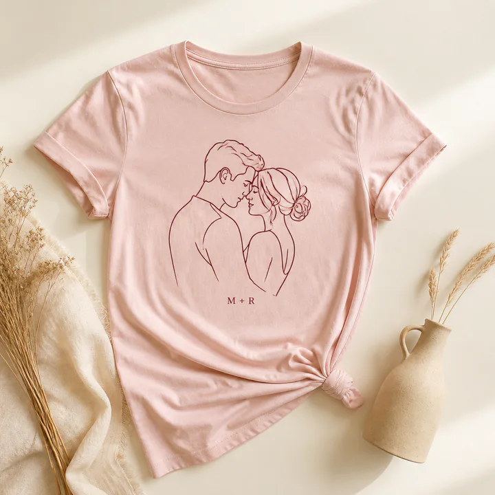 Blush T-shirt printed with a custom couple line illustration