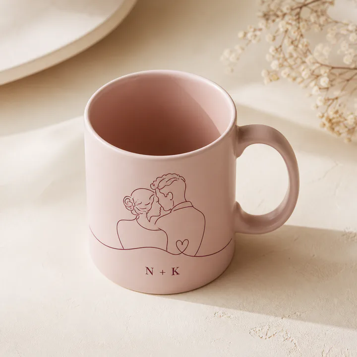 Blush mug with a personalized couple line illustration